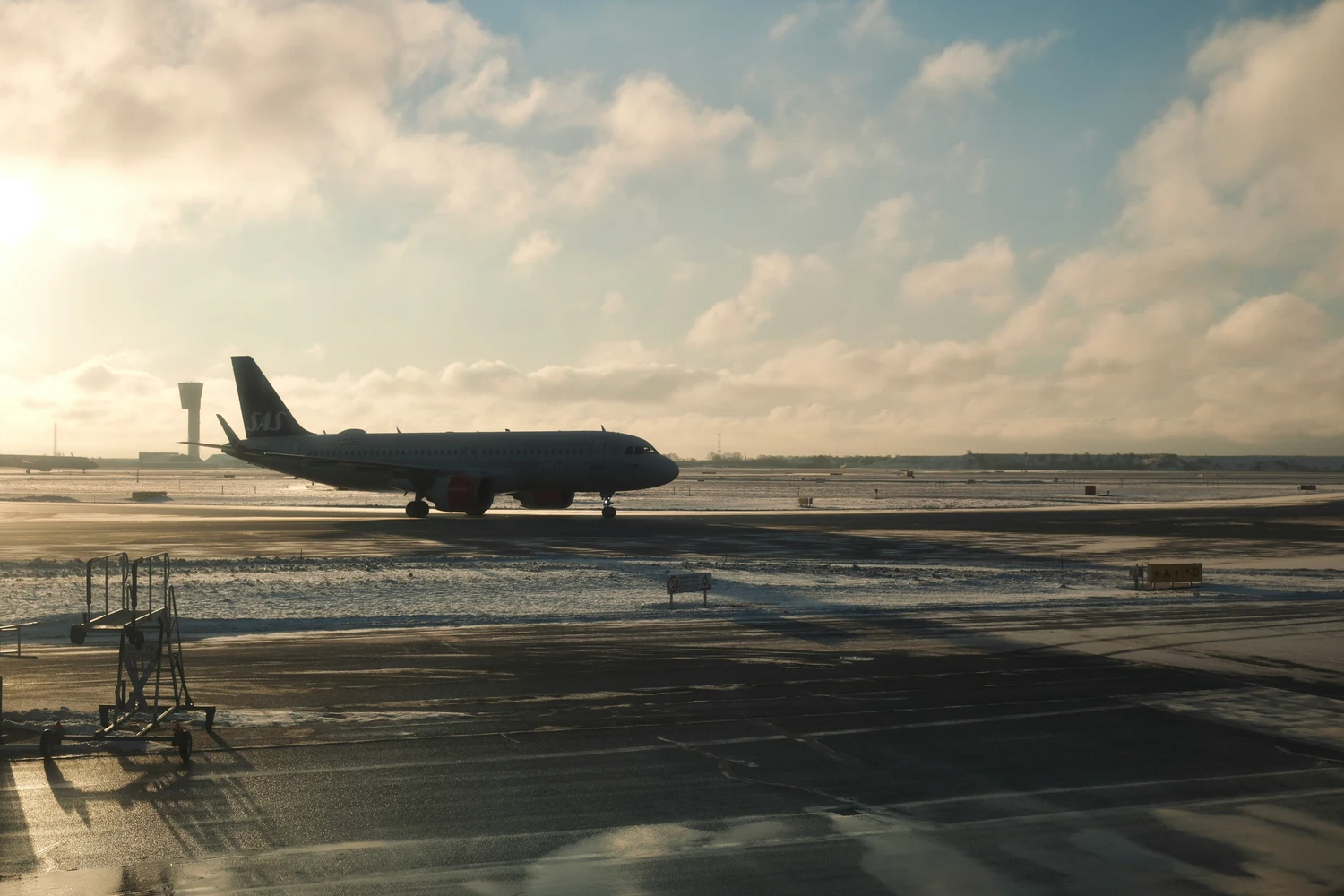 Single aircraft on an empty snow-covered apron at sunrise — Ukraine airports reconstruction and the adopted aviation strategy to 2030
