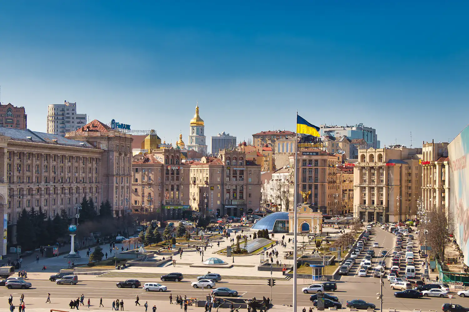 Central Kyiv on a working day: traffic, people and commercial buildings