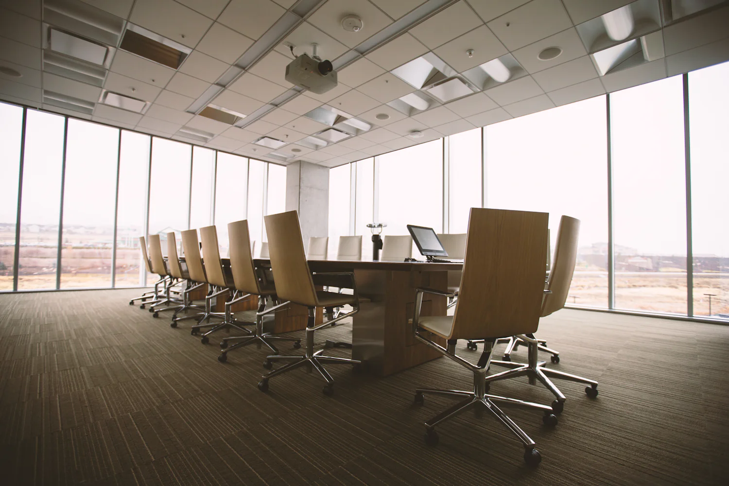 Empty boardroom with a long table and chairs before a signing