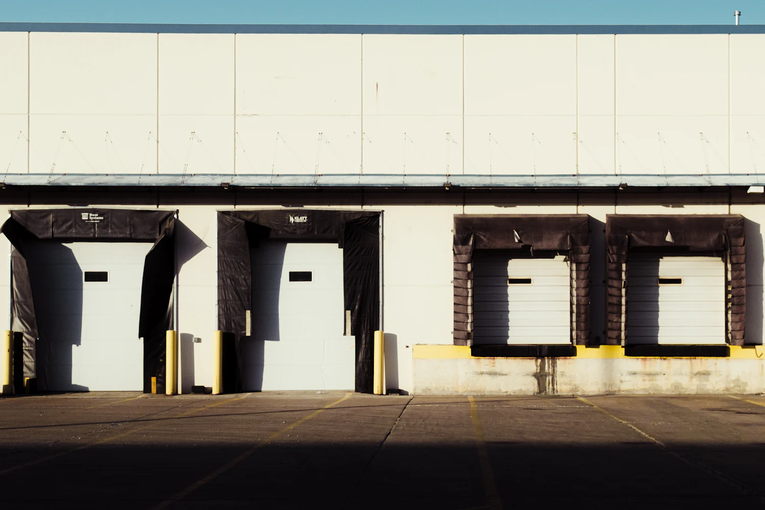 Row of loading docks on a warehouse — immovable property in Ukraine falls under the exclusive jurisdiction of Ukrainian courts
