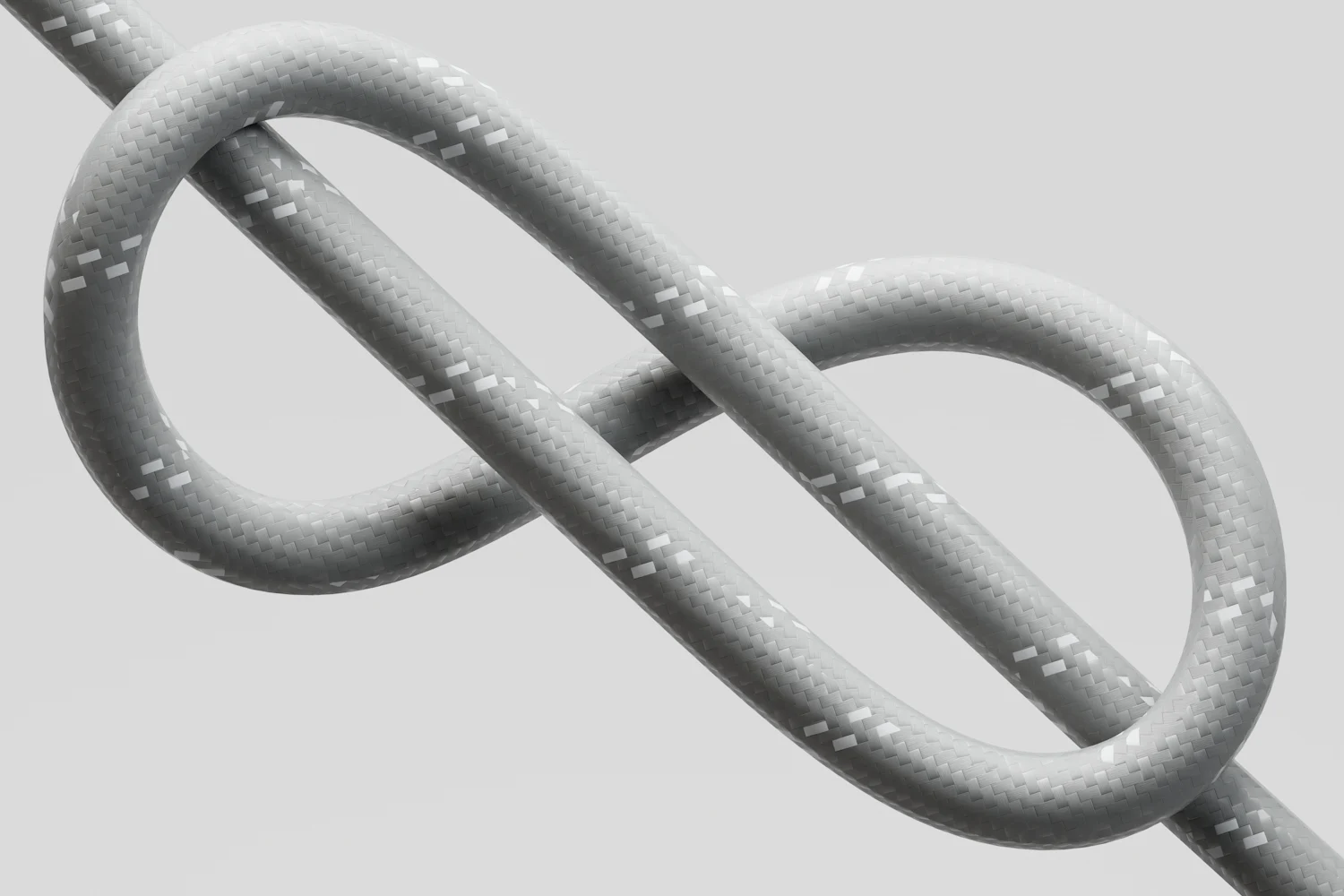 Grey rope tied in a figure-eight knot on a light background