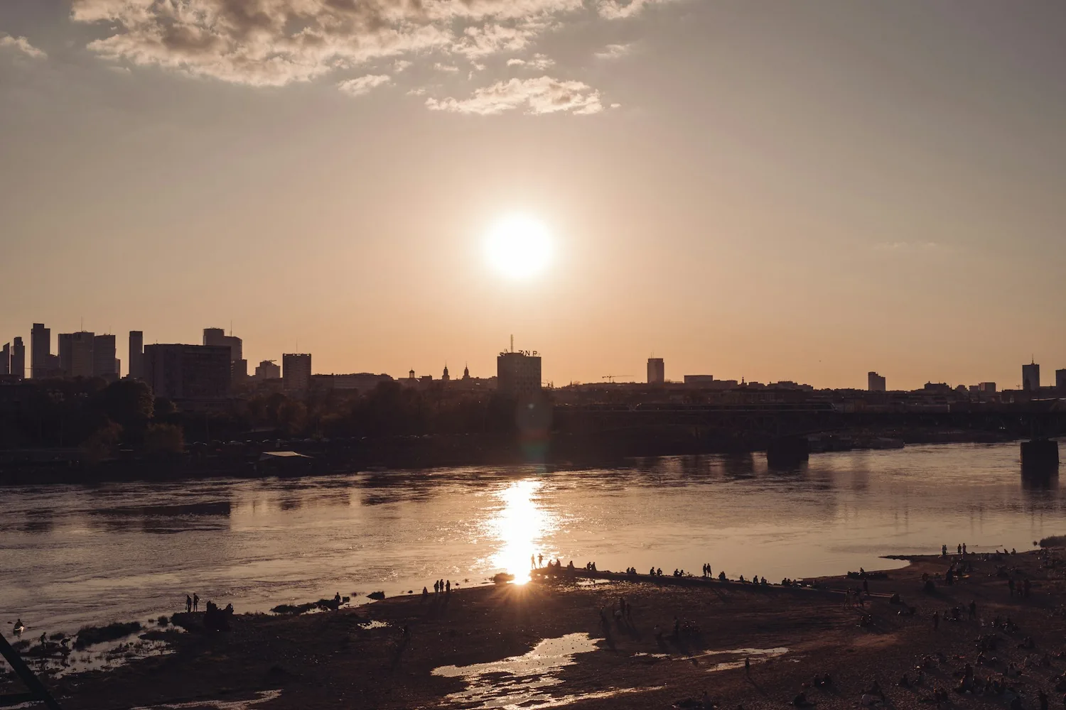 Warsaw skyline over the Vistula at sunset — recognising a Polish judgment in Ukraine